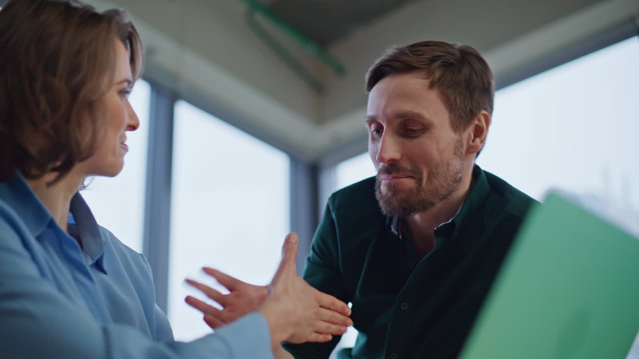 Happy team members rejoicing successful project browsing laptop office closeup