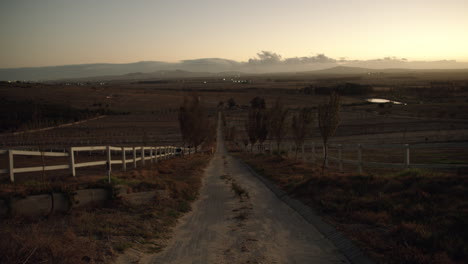 4k drone footage of an empty path on a ranch