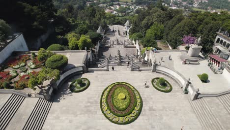 aerial tilt up view sanctuary bom jesus iconic stairs with braga scenic landscape