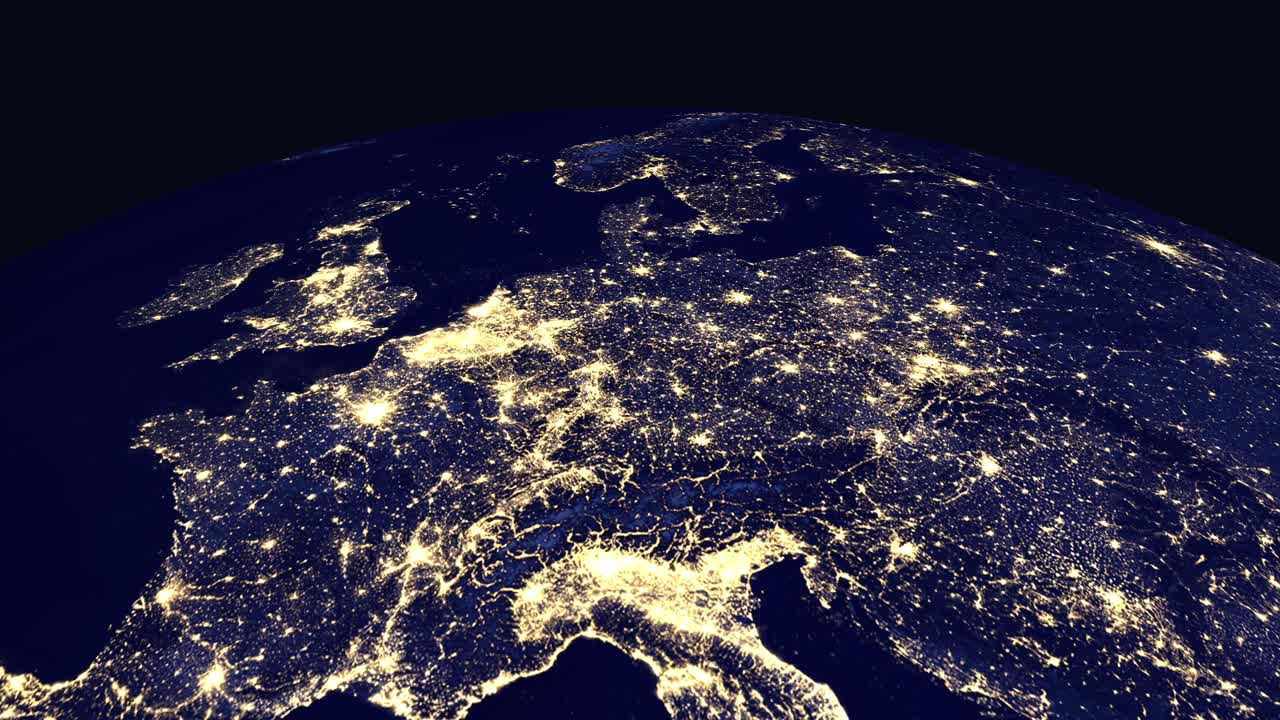 Digital animation zooms from space into illuminated European cities at night with country labels