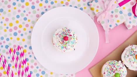 putting cup cake from cutting board to plate. stop motion