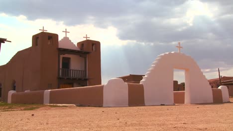 an old adobe church stands at the taos pueblo in new mexico