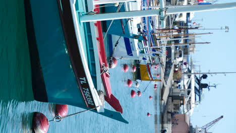 Vertical-Video-of-Sailing-Boats-and-Yachts-Docked-in-Nice-Harbour,-Port-de-Nice