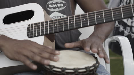 man playing guitar closeup