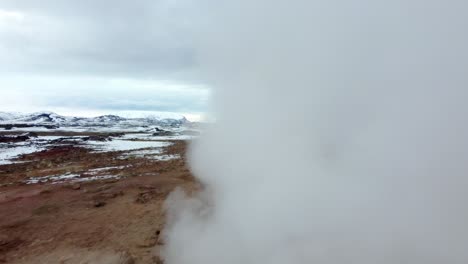 Aerial-view-of-boiling-mud-pits-and-fumaroles-in-Hverir,-Iceland