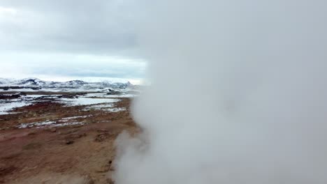 aerial view of boiling mud pits and fumaroles in hverir, iceland