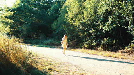 blonde woman walking with phone full shot