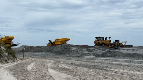 sandscaping by bulldozers during beach replenishment reclaim project