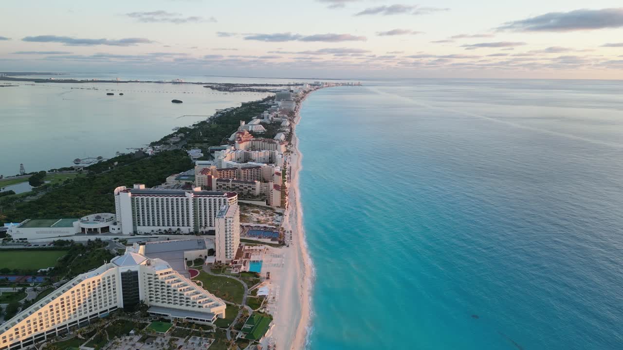 Cancun coastline showcasing the beautiful beach and hotels along the shore, aerial view, playa delfines