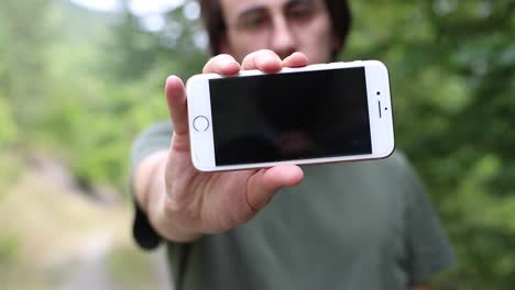 male teenager writing on a phone