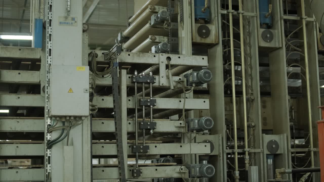 Industrial Machine Operating with Moving Parts in a Factory