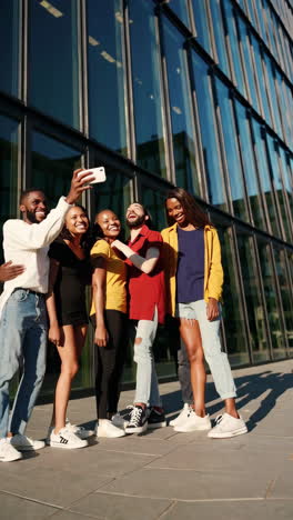 diverse group of friends taking a selfie outdoors
