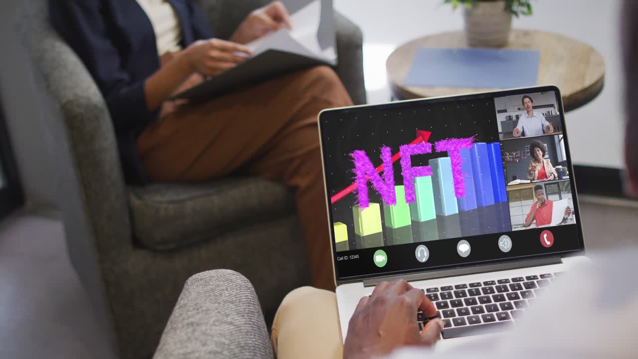 Video of biracial woman having nft video call on tablet with diverse coworkers