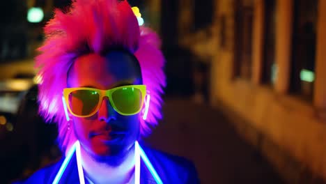 man in neon at night