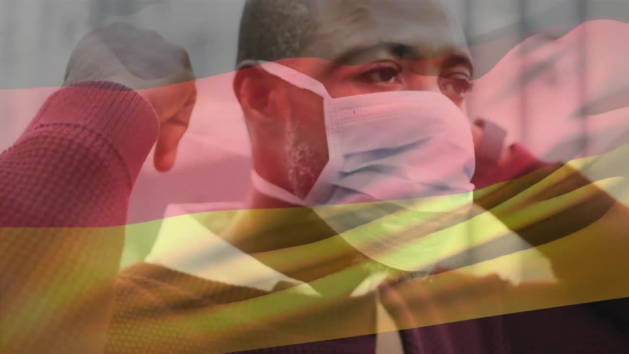 도시 거리에서 얼굴 마스크를 쓰고 있는 아프리카계 미국인 남자가 독일 국기를 흔들고 있는 애니메이션