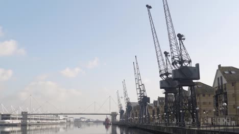 port cranes and waterfront cityscape