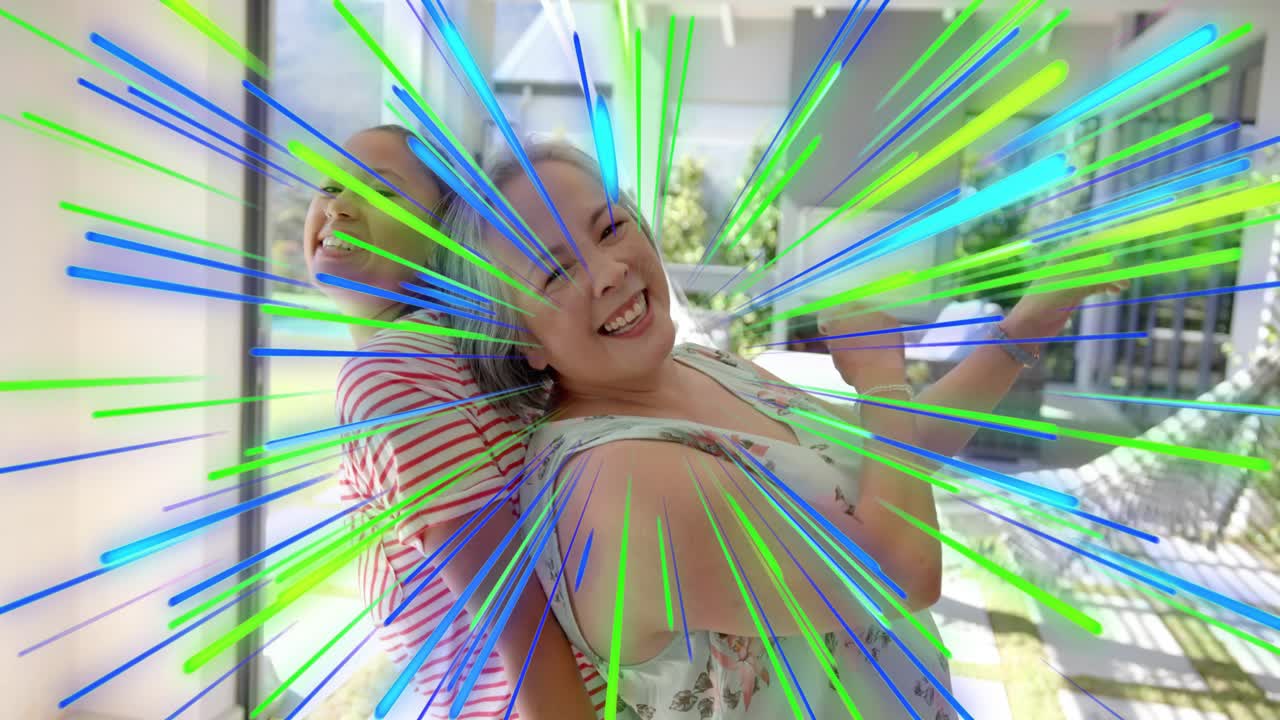 Mother-daughter pressing backs together on porch glass wall sparking radial streaks for branding