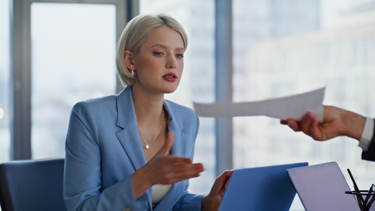 Closeup businesswoman writing papers at panoramic cabinet. Lady taking report