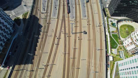 train railroad and tracks of vienna central station, aerial overview, wien hauptbahnhof flyover, sunny day in the city of vienna