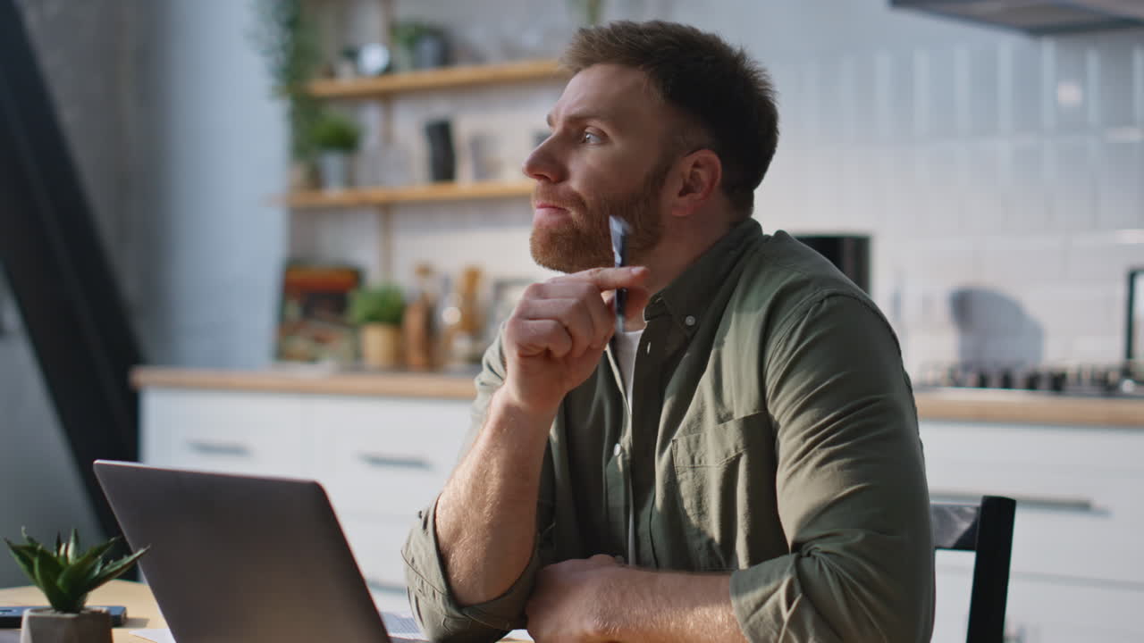 Pensive entrepreneur thinking project working in home office laptop closeup