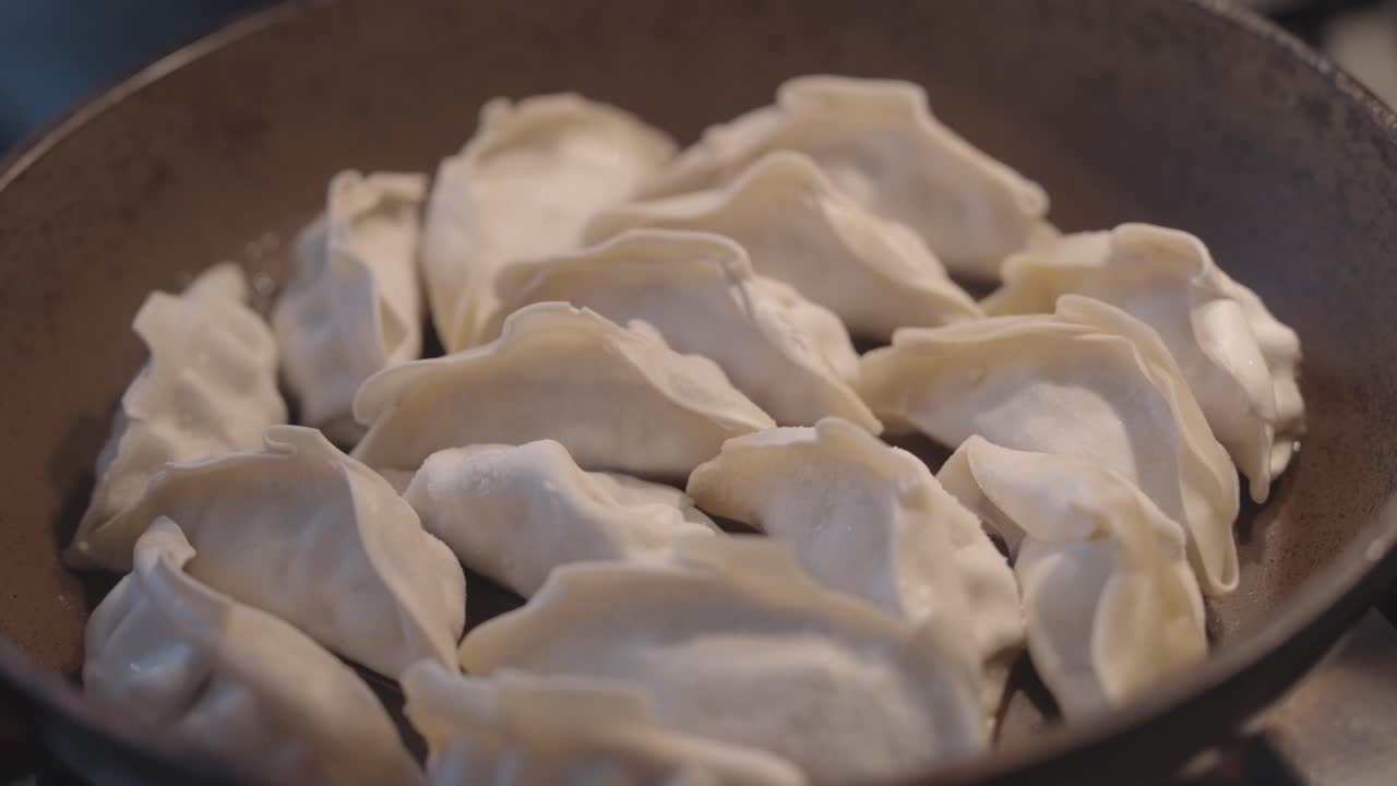 Close-up of stuffed dumplings made of dough. Home-made dinner preparation