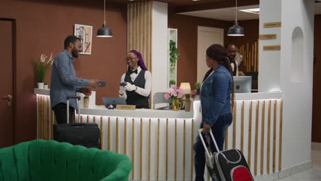 tourists registering at front desk