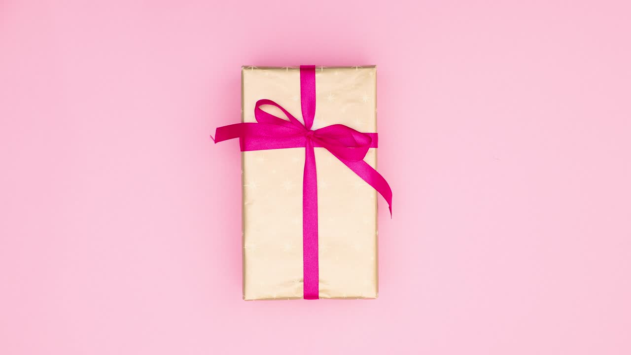 Feminine gifts changing slowly on pink theme. Stop motion birthday