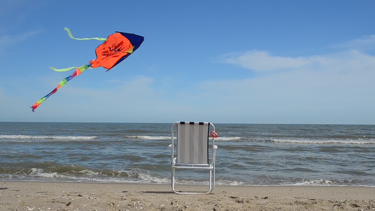Chaise lounge on the beach, the sea and a kite. Summer Time in Beach Sea Shore