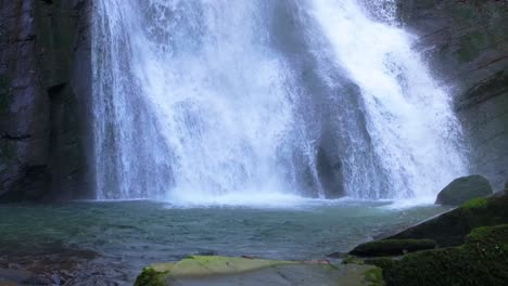 splashing water of vilagocende waterfalls in a fonsagrada, lugo, spain