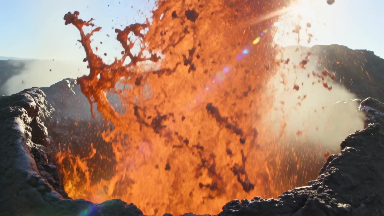 Pushing molten dome launching lava fountain at crater rim, ejecting incandescent droplets and plume
