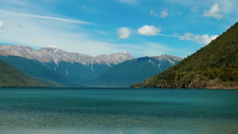 lake rotoroa: majestic mountains frame serene waters