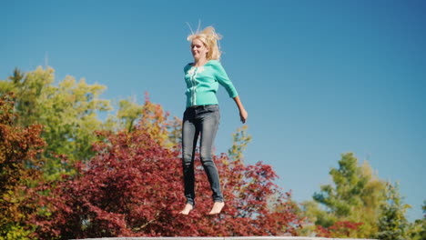 Blonde-Woman-Jumping-on-a-Trampoline