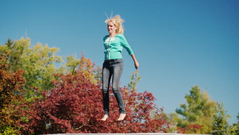 blonde woman jumping on a trampoline