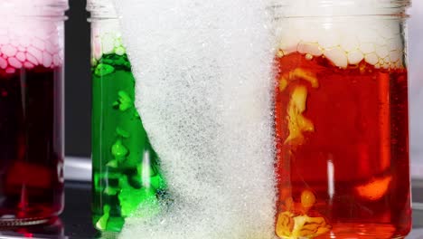 vibrant liquids react with dry ice, creating bubbles