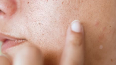 face mole scrutinise with hand, close up 4k shot