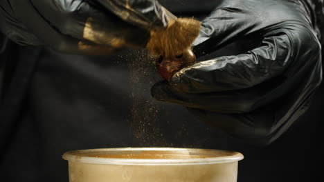 Applying Gold Powder to a Small Object