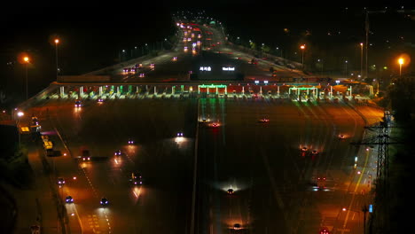 night traffic at a highway toll booth