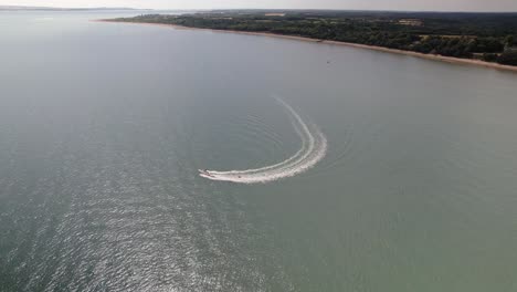 Wakeboarder-Towed-Behind-A-Motorboat---Wakeboarding-In-The-Solent-Strait-Near-Calshot,-UK