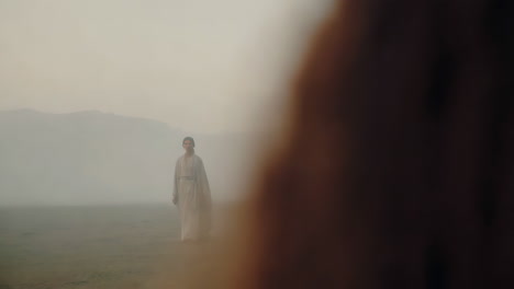 woman in a pale kimono, misty desert landscape