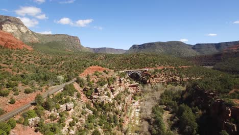 Aerial push in on Midgley Bridge along Oak Creek, Sedona, Arizona.