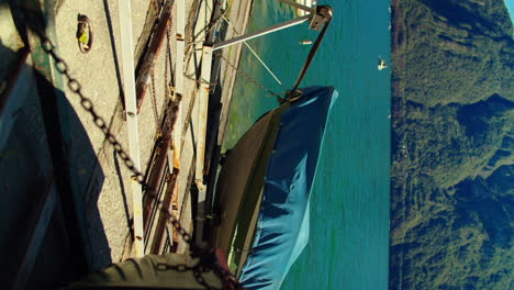 beautiful port on the coast of lake como in italy with moored fishing boats