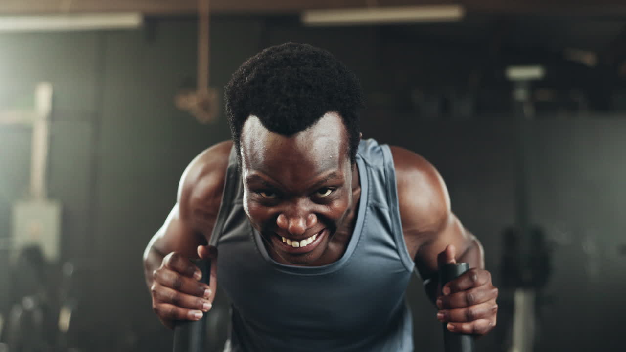 Black man at gym, weight sled