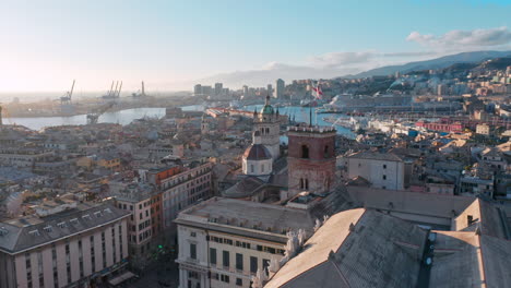 aerial over historic old city of genoa, italy - skyline view of porto antico