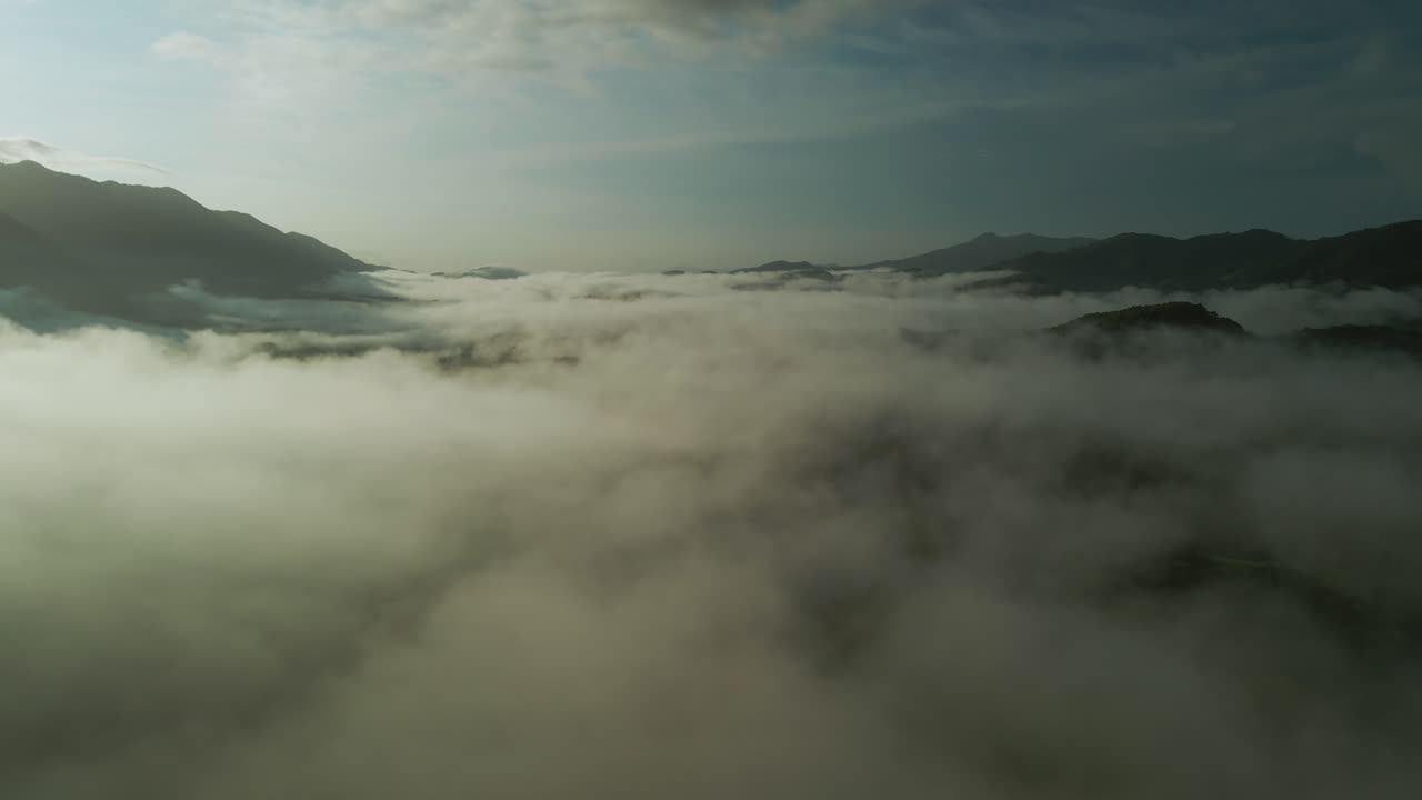 Flight over the mist and sunset in the dense tropical forests of Costa Rica, 4K
