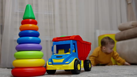 baby playing with colorful toys