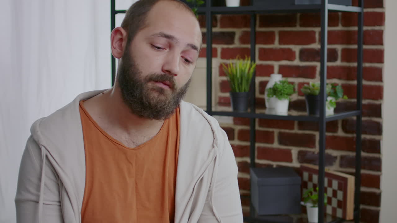 Alcohol addict having mental breakdown and crying at aa group meeting with therapist