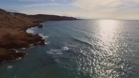 Aerial:-A-quiet-beach-on-Karpathos-island,-Greece