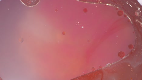 macro rosas burbujas de gelatina líquida movimiento fondo con textura