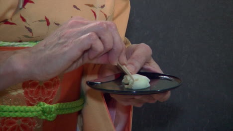 a wagashi tea sweet is eaten during a japanese tea ceremony