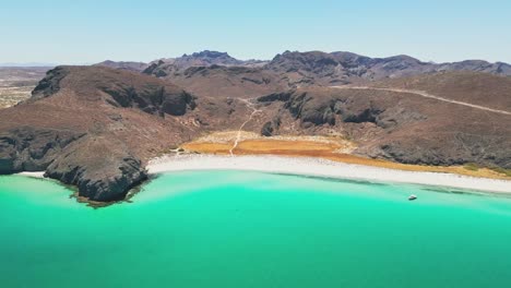 aerial shot of tecolote beach in la paz, showing turquoise waters and rocky hills